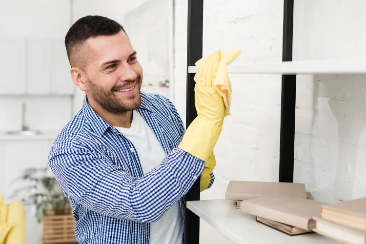 happy man cleaning with rag